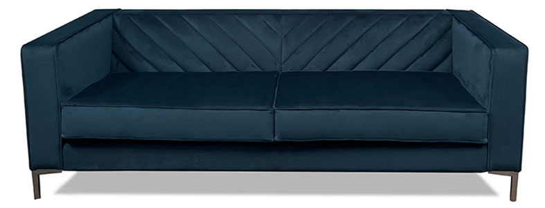 Emerson sofa upholstered in blue velvet with chevron fluting.