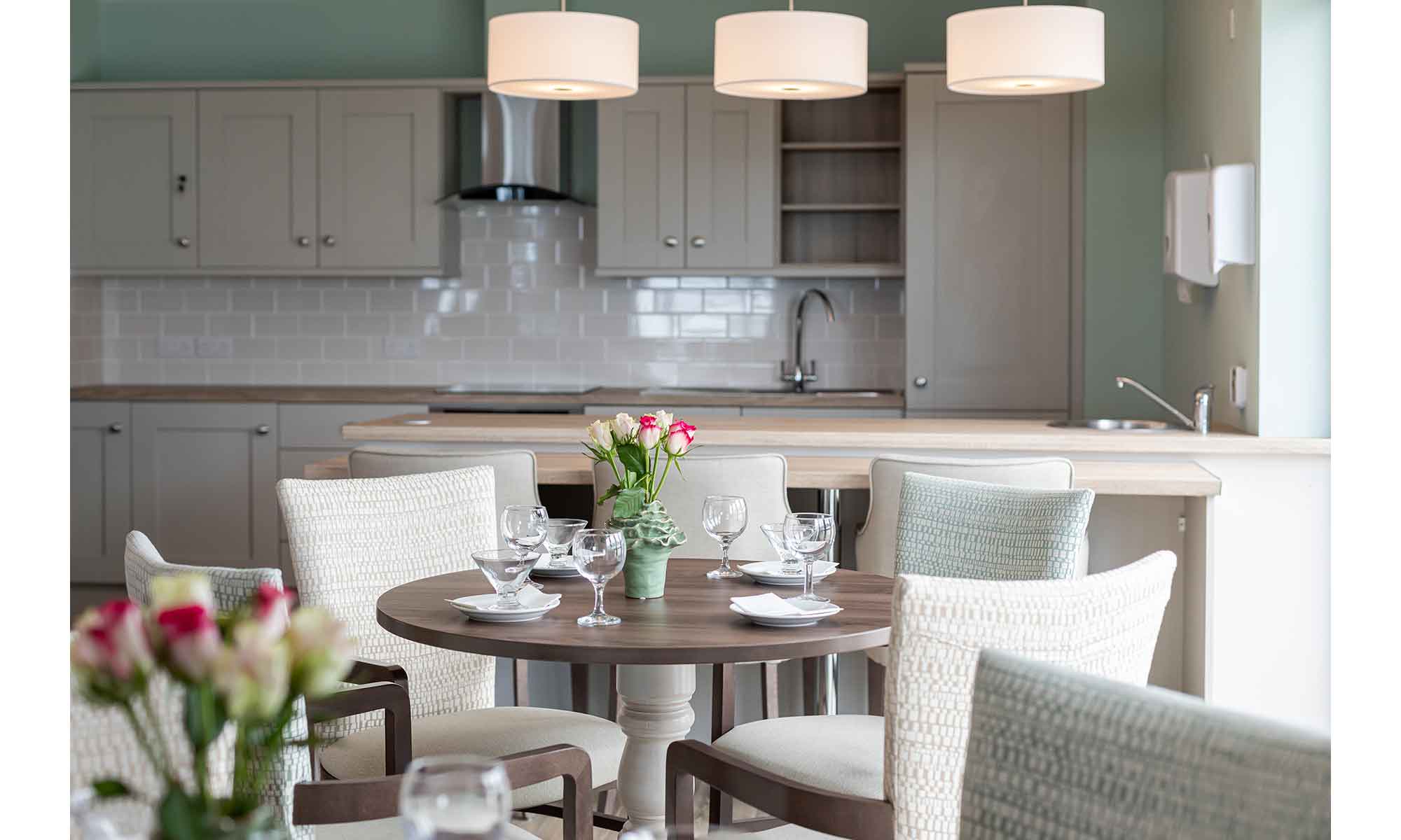 Dining room in a care home. Close up shot of the Woodbury dining table and Assisi dining chairs