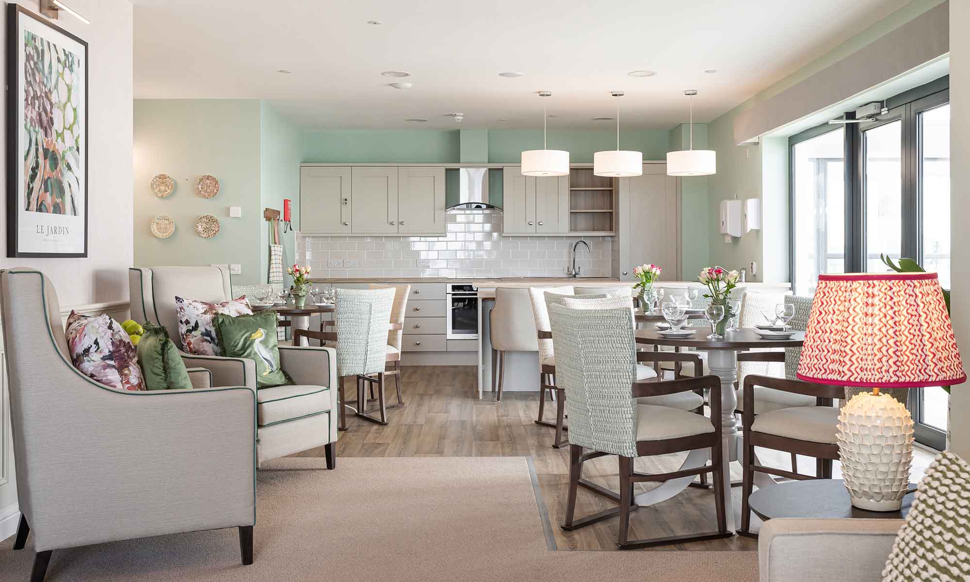 Lounge area at Copelands Residential. Showing the Orto High Back Chair, Woodbury dining table and Assisi dining chairs.