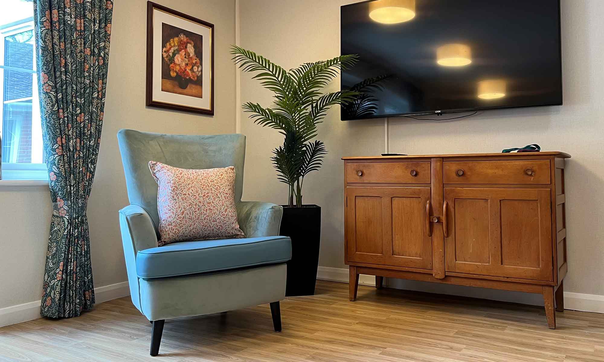 Retro lounge at Hazeldell care home showing the Shackletons Saluzzo high back chair in duck egg.