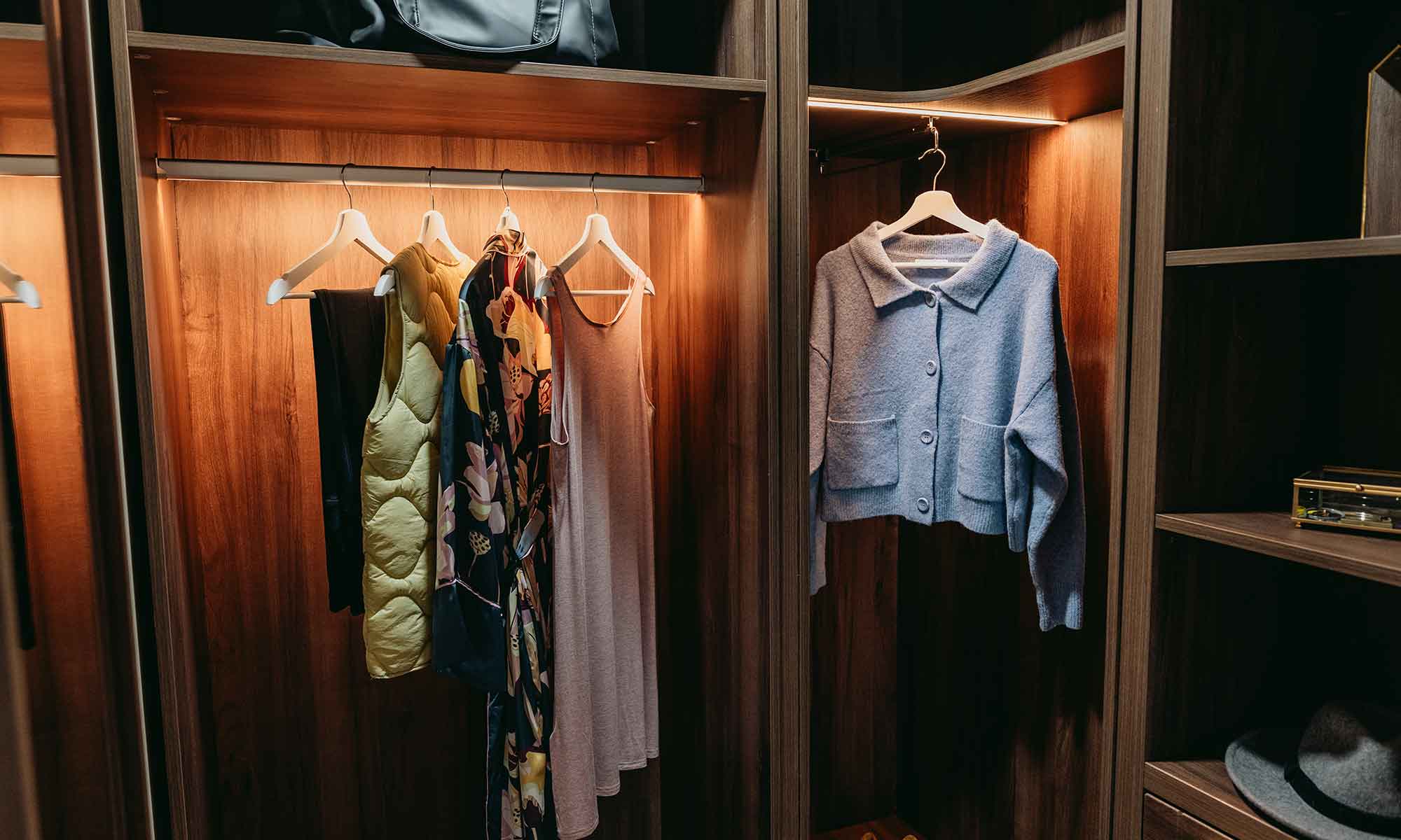 Clothes hanging in a wardrobe