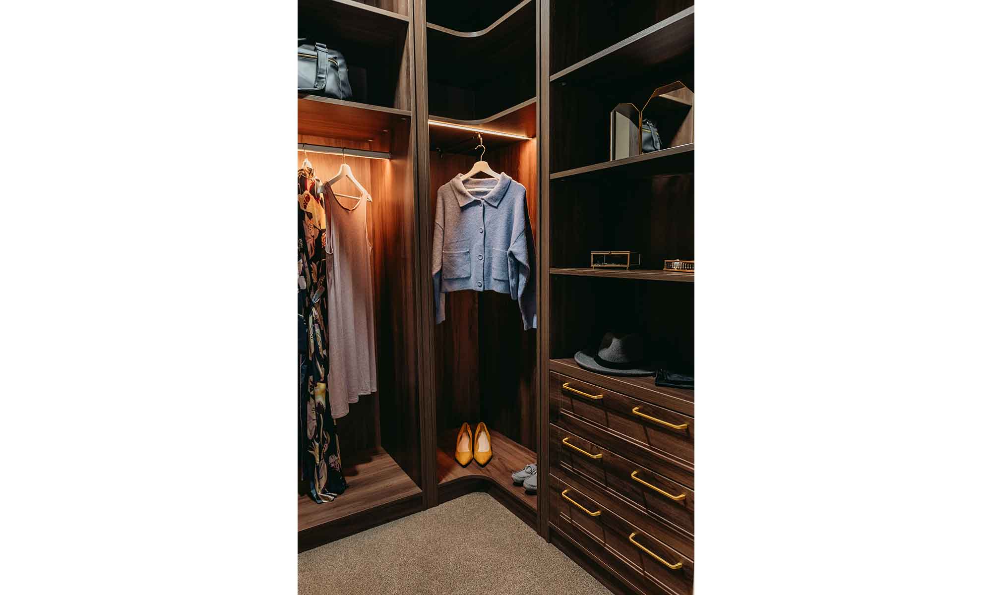 Clothes hanging in a wardrobe