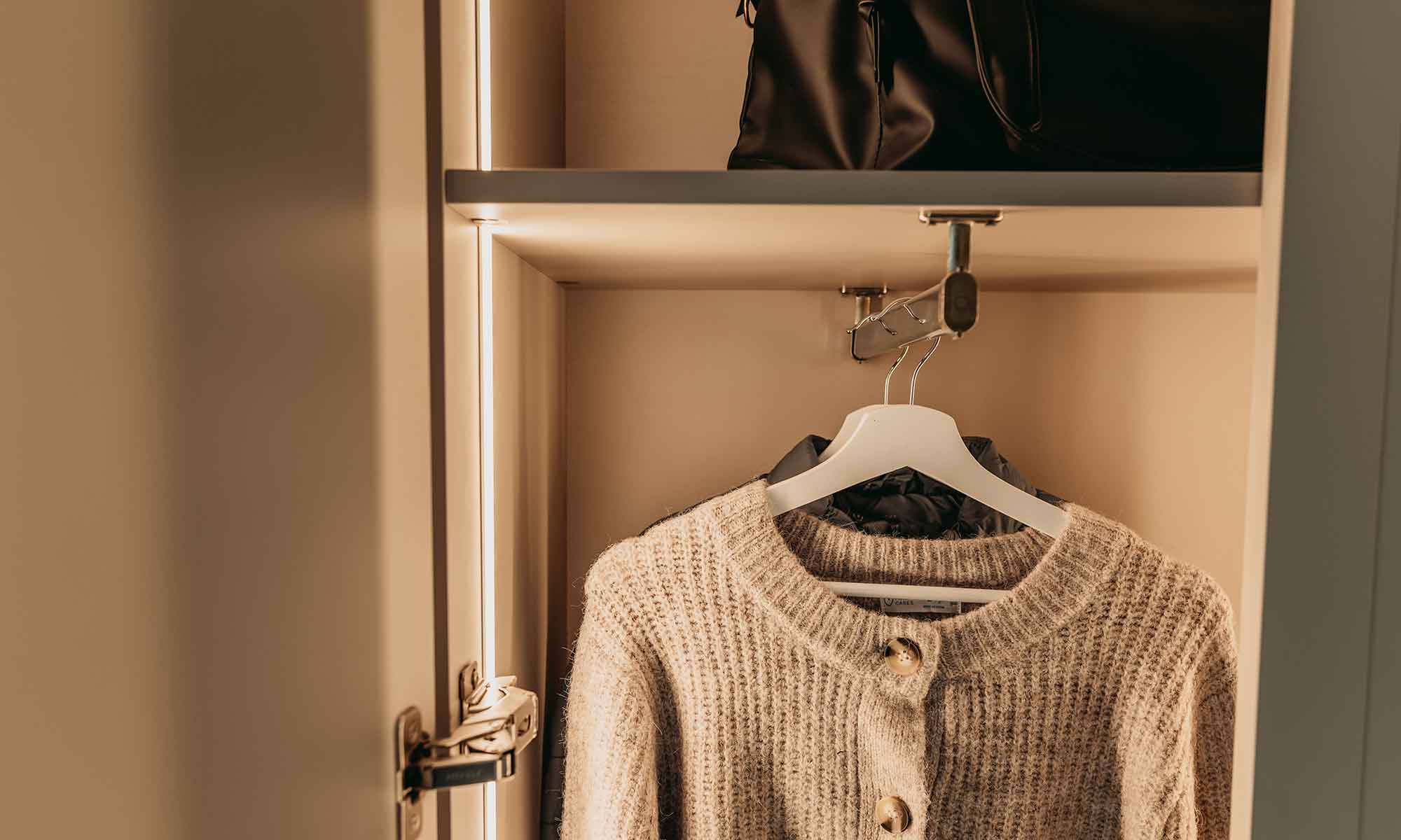 Dementia friendly clothes rail with clothes hanging front to back